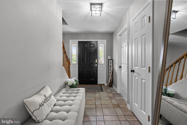 613 Main St, Langhorne, PA 19047 - foyer entrance with stairs and light tile patterned floors