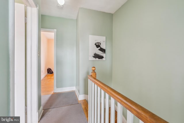 6604 Altamont Ave, Baltimore, MD 21228 - corridor featuring an upstairs landing and wood finished floors