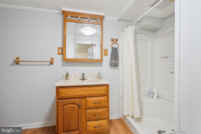 6604 Altamont Ave, Baltimore, MD 21228 - bathroom with curtained shower, vanity, and wood finished floors