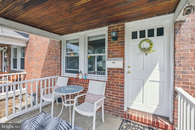 6604 Altamont Ave, Baltimore, MD 21228 - view of exterior entry with brick siding and covered porch