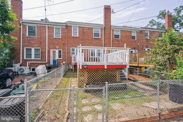 6604 Altamont Ave, Baltimore, MD 21228 - rear view of property with a gate, a fenced backyard, a deck, a chimney, and brick siding