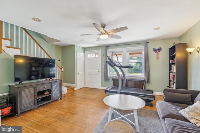 6604 Altamont Ave, Baltimore, MD 21228 - living area featuring stairs, wood finished floors, and a ceiling fan