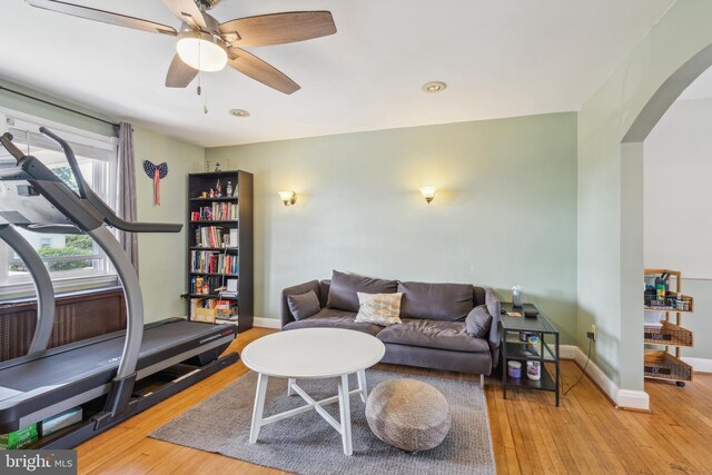 6604 Altamont Ave, Baltimore, MD 21228 - living area featuring arched walkways, wood-type flooring, and ceiling fan