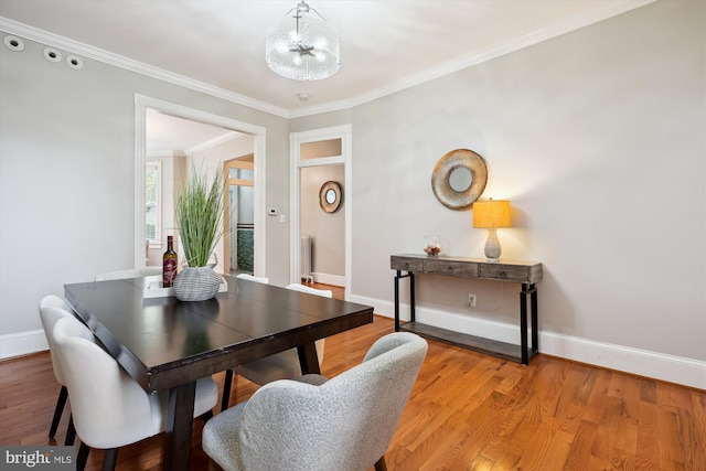 609 Elliott St NE, Washington, DC 20002 - dining room featuring a chandelier, ornamental molding, and wood finished floors