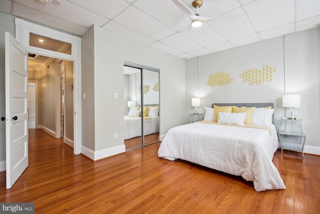 609 Elliott St NE, Washington, DC 20002 - bedroom featuring a closet, a paneled ceiling, and light wood-style floors