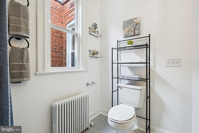 609 Elliott St NE, Washington, DC 20002 - bathroom with radiator, tile patterned flooring, and plenty of natural light