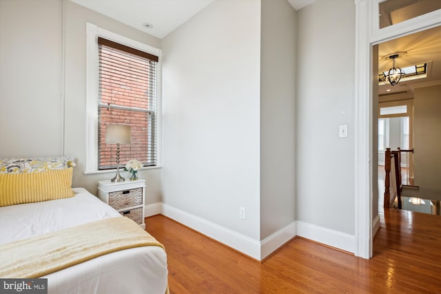 609 Elliott St NE, Washington, DC 20002 - bedroom featuring light wood-style floors and a chandelier