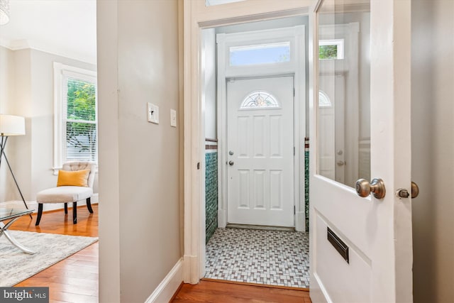 609 Elliott St NE, Washington, DC 20002 - entrance foyer with healthy amount of natural light, wood finished floors, and ornamental molding