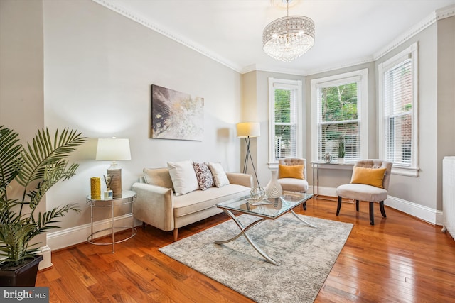 609 Elliott St NE, Washington, DC 20002 - living room with ornamental molding, hardwood / wood-style flooring, and a chandelier