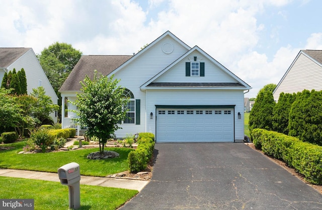 13 Wauwinet Ct, Rehoboth Beach, DE 19971 - traditional home with driveway, a front lawn, a shingled roof, and an attached garage