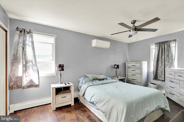 1048 Acorn, Stowe, PA 19464 - bedroom with an AC wall unit, a baseboard radiator, dark wood-style floors, and a ceiling fan