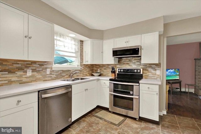 1048 Acorn, Stowe, PA 19464 - kitchen featuring appliances with stainless steel finishes, light countertops, and white cabinets