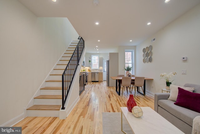 921 S Conestoga St, Philadelphia, PA 19143 - living room featuring stairs, recessed lighting, and light wood-type flooring