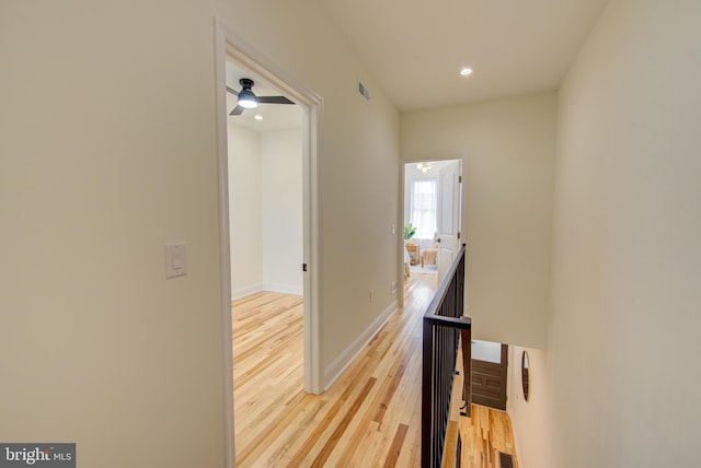 921 S Conestoga St, Philadelphia, PA 19143 - corridor featuring light wood-style floors, recessed lighting, and an upstairs landing
