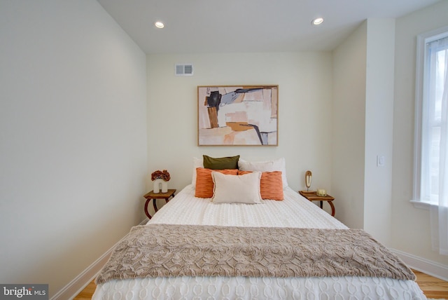 921 S Conestoga St, Philadelphia, PA 19143 - bedroom with wood finished floors, multiple windows, and recessed lighting