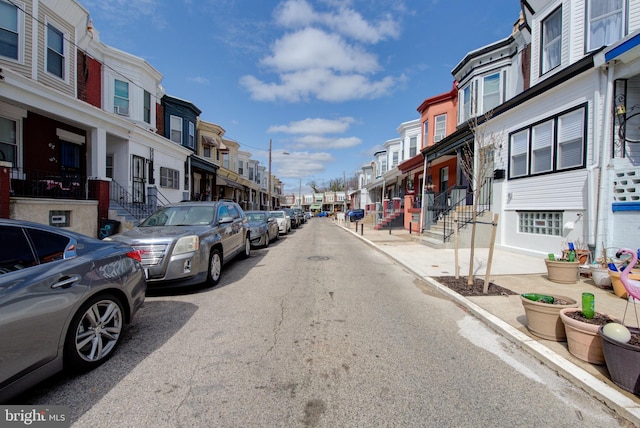 921 S Conestoga St, Philadelphia, PA 19143 - view of asphalt street with a residential view, curbs, and street lights