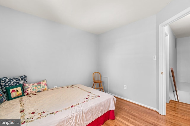 8857 Blade Green Ln, Columbia, MD 21045 - bedroom with wood finished floors and baseboards