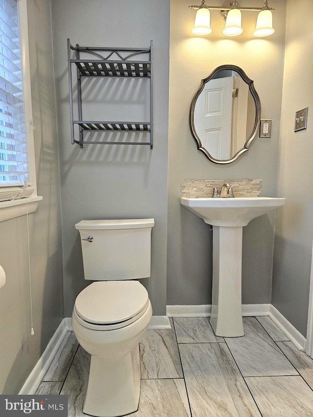 18 N 5th St, Columbia, PA 17512 - half bathroom featuring baseboards and toilet