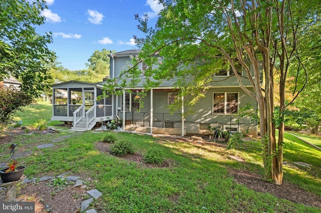 12330 Needlepine Ter, Silver Spring, MD 20904 - back of house featuring a sunroom and a yard