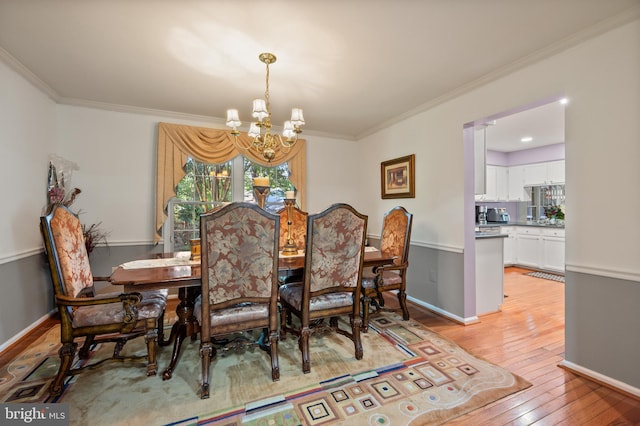 12330 Needlepine Ter, Silver Spring, MD 20904 - dining space with a chandelier, light wood-style floors, and crown molding