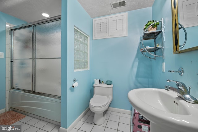 12330 Needlepine Ter, Silver Spring, MD 20904 - full bath with combined bath / shower with glass door, a textured ceiling, and tile patterned flooring