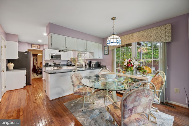 12330 Needlepine Ter, Silver Spring, MD 20904 - dining room with light wood-style flooring and recessed lighting