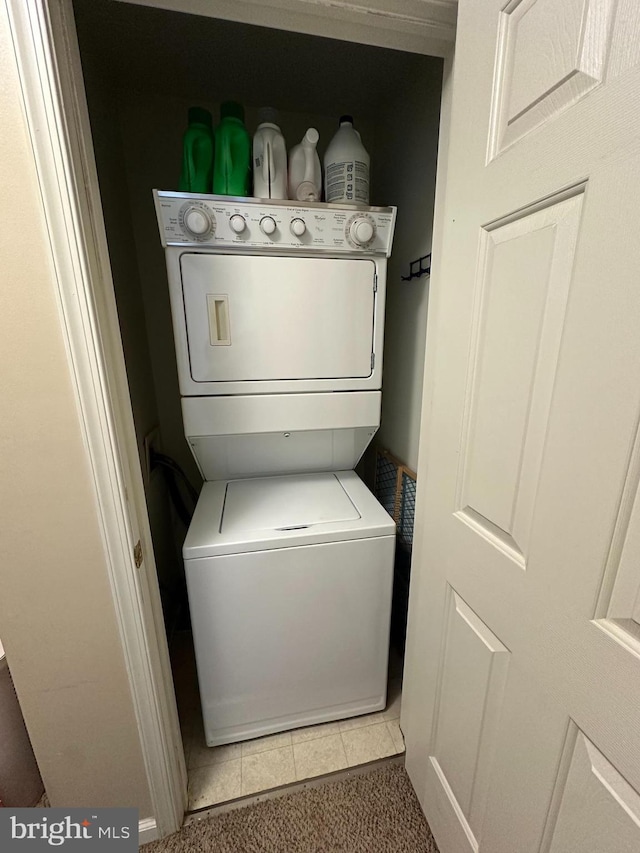 226 Prairie Ct, Quakertown, PA 18951 - laundry area featuring stacked washing machine and dryer and tile patterned floors