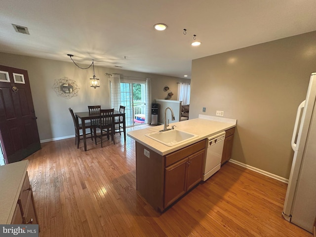 226 Prairie Ct, Quakertown, PA 18951 - kitchen featuring white appliances, a peninsula, wood finished floors, light countertops, and recessed lighting