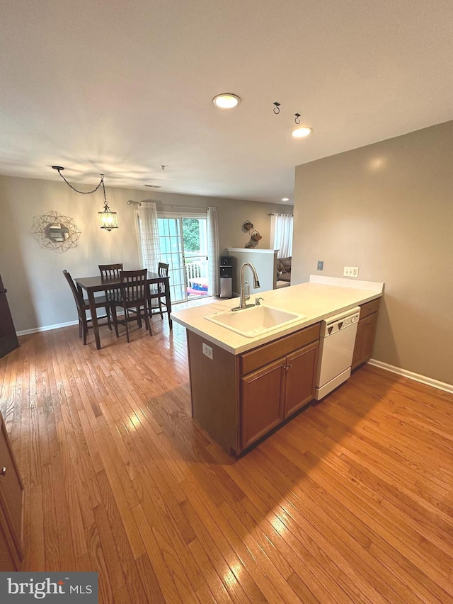 226 Prairie Ct, Quakertown, PA 18951 - kitchen with dishwasher, light wood-style floors, a peninsula, light countertops, and recessed lighting
