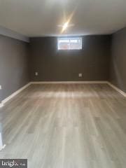 7128 Crestshire, Baltimore, MD 21222 - below grade area featuring wood finished floors and baseboards