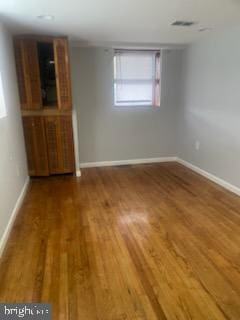 7128 Crestshire, Baltimore, MD 21222 - empty room featuring wood finished floors and baseboards