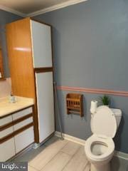 7128 Crestshire, Baltimore, MD 21222 - bathroom featuring crown molding, vanity, and tile patterned flooring