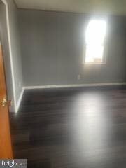 7128 Crestshire, Baltimore, MD 21222 - empty room with baseboards and wood finished floors