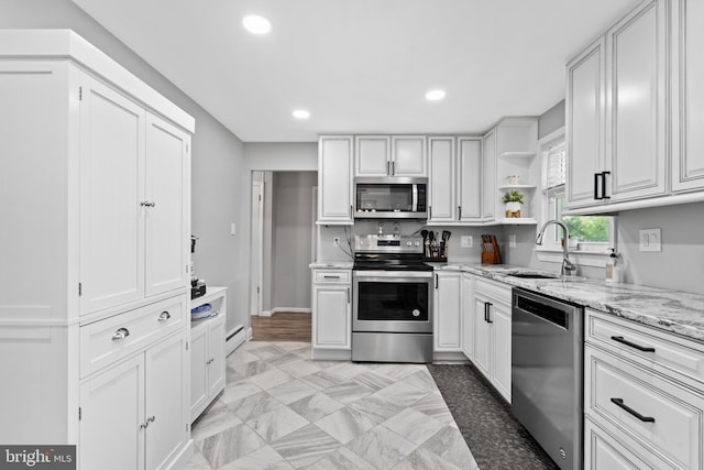 566 S Old Middletown Rd, Media, PA 19063 - kitchen featuring stainless steel appliances, open shelves, light stone countertops, white cabinetry, and recessed lighting