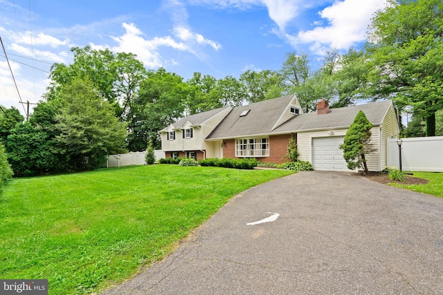 566 S Old Middletown Rd, Media, PA 19063 - split level home featuring a garage, driveway, a chimney, and brick siding