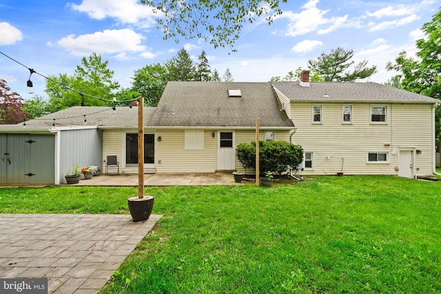 566 S Old Middletown Rd, Media, PA 19063 - rear view of property with a chimney, a lawn, a patio, and roof with shingles