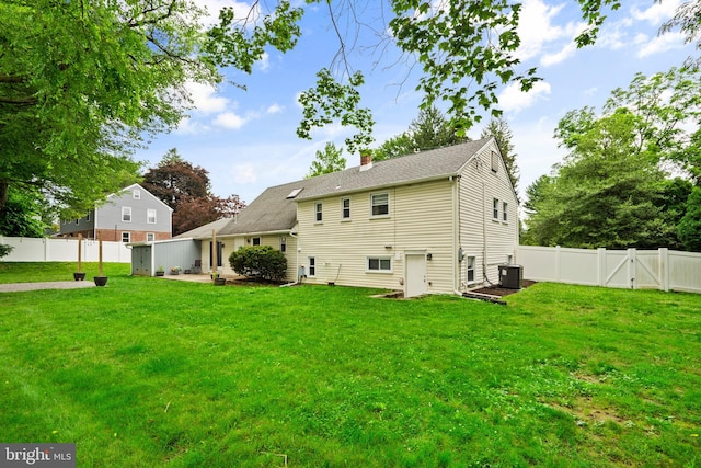 566 S Old Middletown Rd, Media, PA 19063 - rear view of property with a chimney, a fenced backyard, a patio, a gate, and roof with shingles