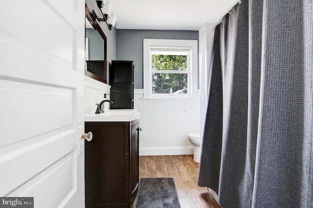 415 Grape St, Hammonton, NJ 08037 - bathroom with vanity, wainscoting, wood finished floors, and curtained shower