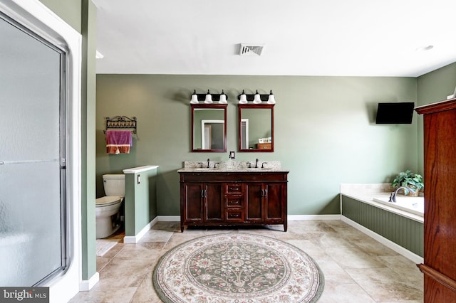 415 Grape St, Hammonton, NJ 08037 - bathroom with double vanity, a garden tub, a shower stall, and tile patterned floors