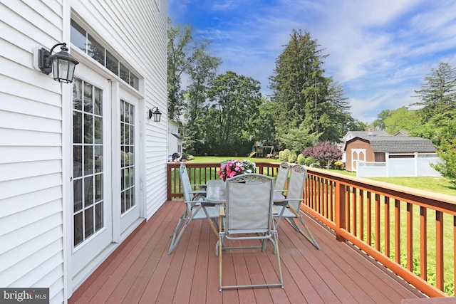 415 Grape St, Hammonton, NJ 08037 - wooden deck featuring outdoor dining space and a lawn