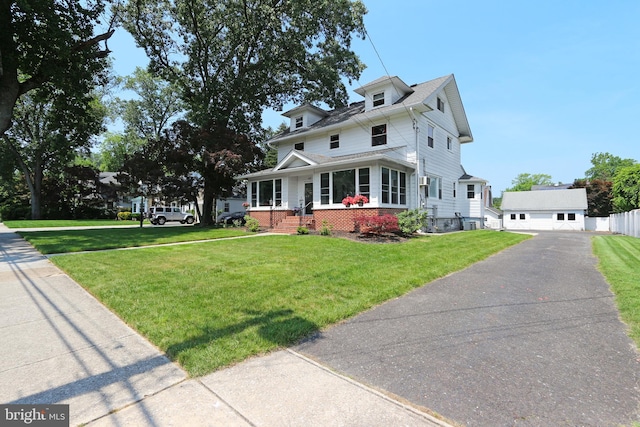 415 Grape St, Hammonton, NJ 08037 - american foursquare style home with a porch, a front lawn, and a garage