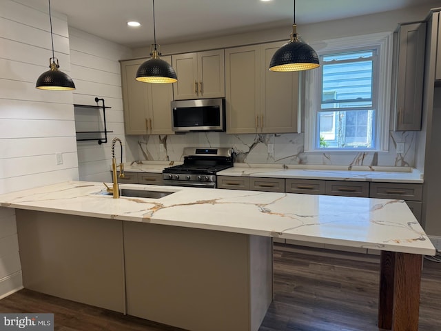 716 S Washington St, Havre De Grace, MD 21078 - kitchen with appliances with stainless steel finishes, gray cabinets, dark wood-style floors, light stone counters, and pendant lighting