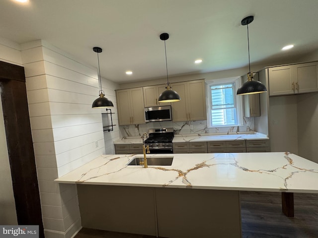 716 S Washington St, Havre De Grace, MD 21078 - kitchen featuring appliances with stainless steel finishes, light stone countertops, tasteful backsplash, hanging light fixtures, and gray cabinets