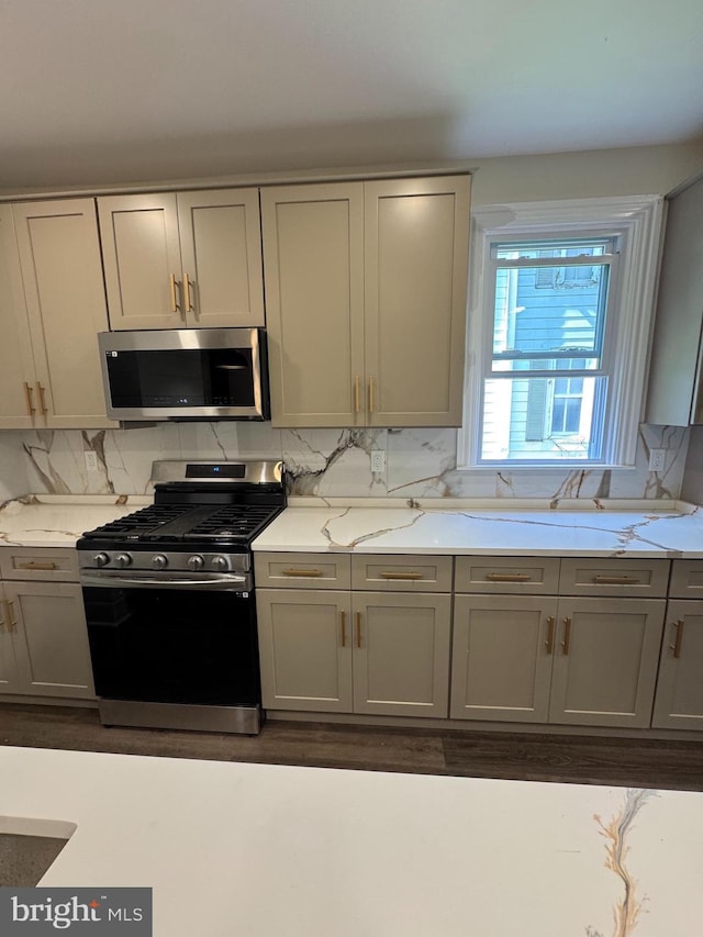 716 S Washington St, Havre De Grace, MD 21078 - kitchen featuring appliances with stainless steel finishes, gray cabinets, and decorative backsplash