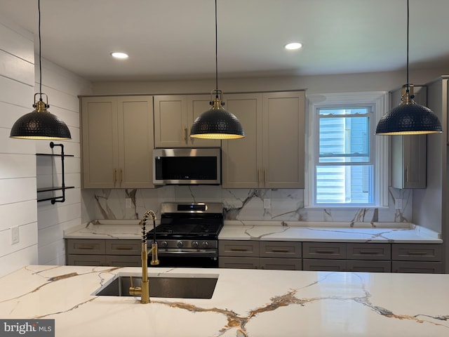 716 S Washington St, Havre De Grace, MD 21078 - kitchen with appliances with stainless steel finishes, gray cabinets, light stone countertops, pendant lighting, and recessed lighting