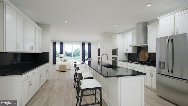 42227 Shining Star Sq, Ashburn, VA 20148 - kitchen with stainless steel appliances, wall chimney range hood, dark countertops, tasteful backsplash, and recessed lighting
