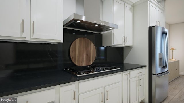 42227 Shining Star Sq, Ashburn, VA 20148 - kitchen with stainless steel refrigerator with ice dispenser, wall chimney exhaust hood, gas cooktop, tasteful backsplash, and white cabinets