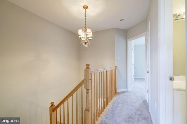 319 Chestertown St, Gaithersburg, MD 20878 - hallway with an upstairs landing, light carpet, and a chandelier