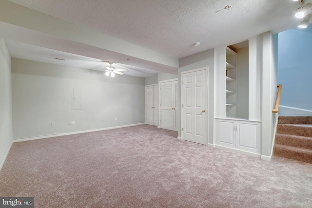 319 Chestertown St, Gaithersburg, MD 20878 - finished basement featuring carpet flooring, a ceiling fan, a textured ceiling, built in features, and stairs