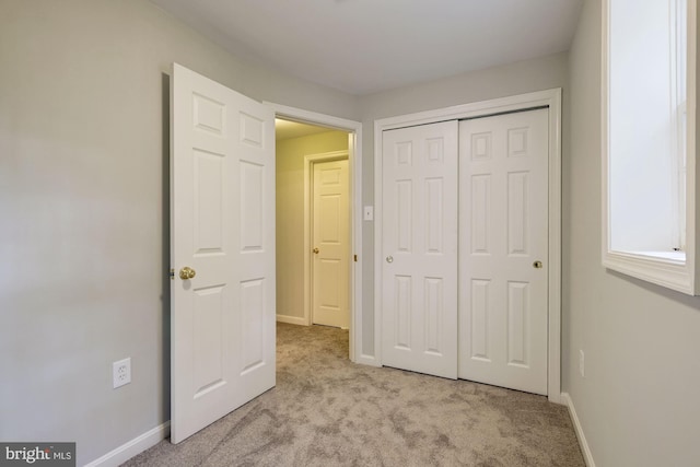 319 Chestertown St, Gaithersburg, MD 20878 - unfurnished bedroom with light colored carpet and a closet
